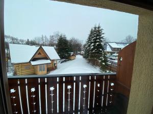 Obiekt Apartamenty pokoje Nad Potokiem zimą