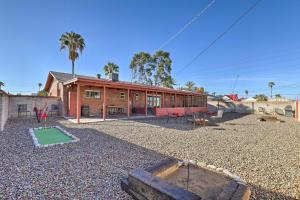 a house with a playground in front of it at Tucson Home with Patio and Games Less Than 1 Mi to Park Place in Tucson
