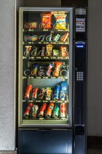 a refrigerator filled with lots of soda and sodas at Hotel Parque Satelite in Mexico City