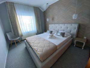 Postel nebo postele na pokoji v ubytování Willa Onyks Apartamenty