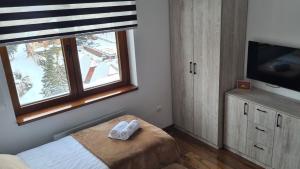 Uma cama ou camas num quarto em Zlatar Apartman br 16