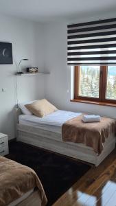 Uma cama ou camas num quarto em Zlatar Apartman br 16