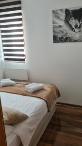 Uma cama ou camas num quarto em Zlatar Apartman br 16