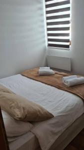 Uma cama ou camas num quarto em Zlatar Apartman br 16