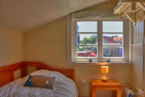 Postel nebo postele na pokoji v ubytování Hostal Triwe