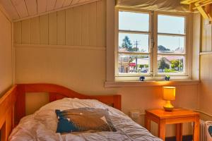 Postel nebo postele na pokoji v ubytování Hostal Triwe
