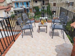 a patio with chairs and a table on a balcony at Apartments Bevk in Piran