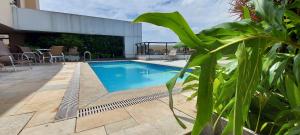 a swimming pool in the middle of a patio at Transamerica Executive Faria Lima in Sao Paulo