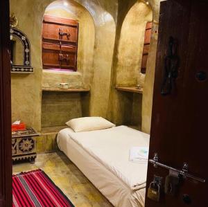 Letto o letti in una camera di Bait Al Aqr