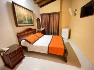Letto o letti in una camera di Hotel Tequendama