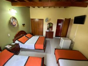 TV a/nebo společenská místnost v ubytování Hotel Tequendama