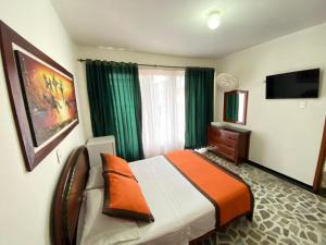 TV a/nebo společenská místnost v ubytování Hotel Tequendama
