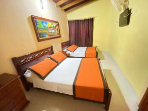 Letto o letti in una camera di Hotel Tequendama