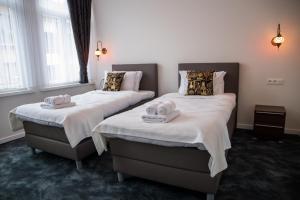Postel nebo postele na pokoji v ubytování Hotel Guzy