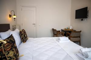 Postel nebo postele na pokoji v ubytování Hotel Guzy