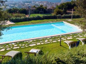 The swimming pool at or close to Belvilla by OYO Corte Dorata