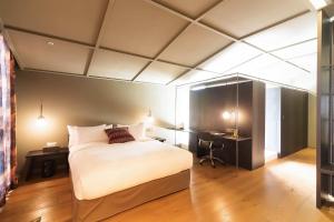 Hotel Museo Cheongju客房内的一张或多张床位