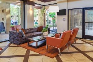 a living room with a couch and a table and chairs at Holiday Inn Club Vacations Scottsdale Resort, an IHG Hotel in Scottsdale