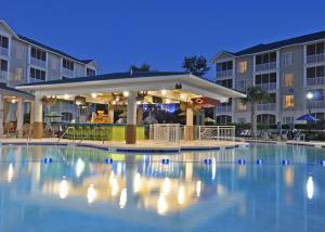 a swimming pool with a gazebo at night at Holiday Inn Club Vacations South Beach Resort in Myrtle Beach