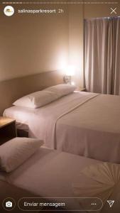 Llit o llits en una habitació de Salinas Park RESORT APARTAMENTO
