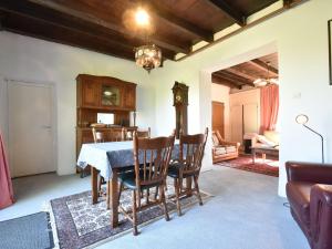 a dining room with a table and chairs at Holiday home in nature near D cize in Decize