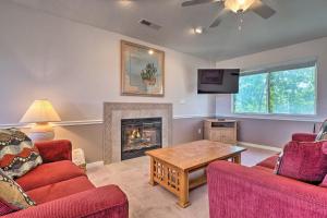 a living room with two couches and a fireplace at Condo with Resort Amenities, by Downtown St George! in St. George