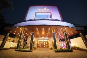 a building with a sign on the top of it at Hotel Le Amritam in Dehradun