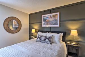 a bedroom with a large white bed with two lamps at Less Than 1 Mi to Peak 8 Ski Condo in Breck with Mtn Views in Breckenridge