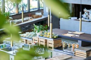 a restaurant with a table with food on it at THE REIGN HOTEL KYOTO in Kyoto