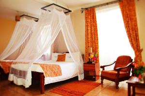 Кровать или кровати в номере ACK Guest House Nairobi