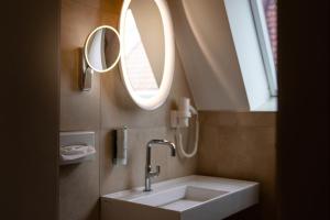 Vannituba majutusasutuses Stadthotel Styria