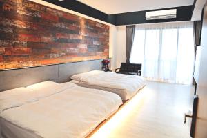 A bed or beds in a room at Sugar Island Inn