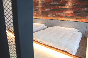 A bed or beds in a room at Sugar Island Inn