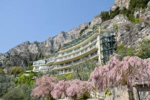 a building on the side of a mountain at HOTEL ASTOR in Limone sul Garda