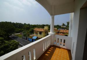 a view from the balcony of a house at Hotel Castle Manor - Auroville Beach in Pondicherry