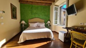 Postel nebo postele na pokoji v ubytování Hotel Piazza Vecchia