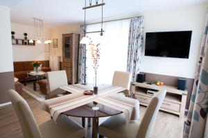TV a/nebo společenská místnost v ubytování Strand Residenz Amrum *Strand Residenz 9*