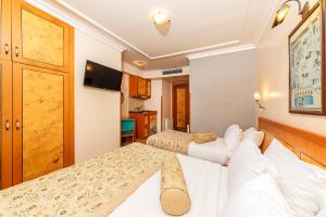Postel nebo postele na pokoji v ubytování Santa Ottoman Hotel