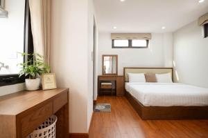 Giường trong phòng chung tại 22housing Hotel & Residence 60 Linh Lang