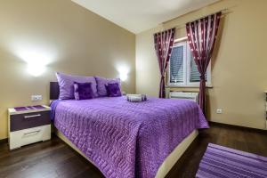 Posteľ alebo postele v izbe v ubytovaní Villa Pave