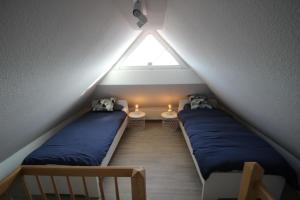 Cama ou camas em um quarto em Ferienhaus Seebrise