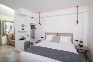 Ein Bett oder Betten in einem Zimmer der Unterkunft Kallos Imar Boutique Hotel