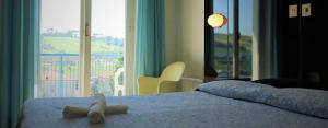 Postel nebo postele na pokoji v ubytování Grand Hotel Excelsior