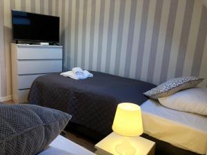 Postel nebo postele na pokoji v ubytování Dom Tkacki - Apartamenty - Pokoje - Jacuzzi