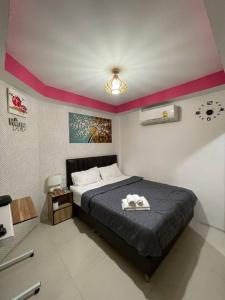 Tempat tidur dalam kamar di Great House 99