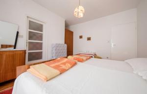 Postel nebo postele na pokoji v ubytování Rooms Dragica