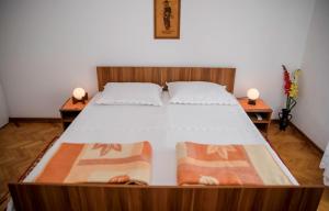 Postel nebo postele na pokoji v ubytování Rooms Dragica