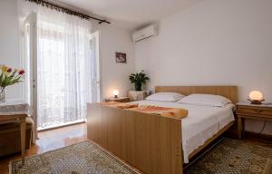 Postel nebo postele na pokoji v ubytování Rooms Dragica