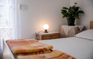 Postel nebo postele na pokoji v ubytování Rooms Dragica