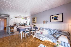 a living room with a couch and a table at Chiemgau Idyll in Bergen